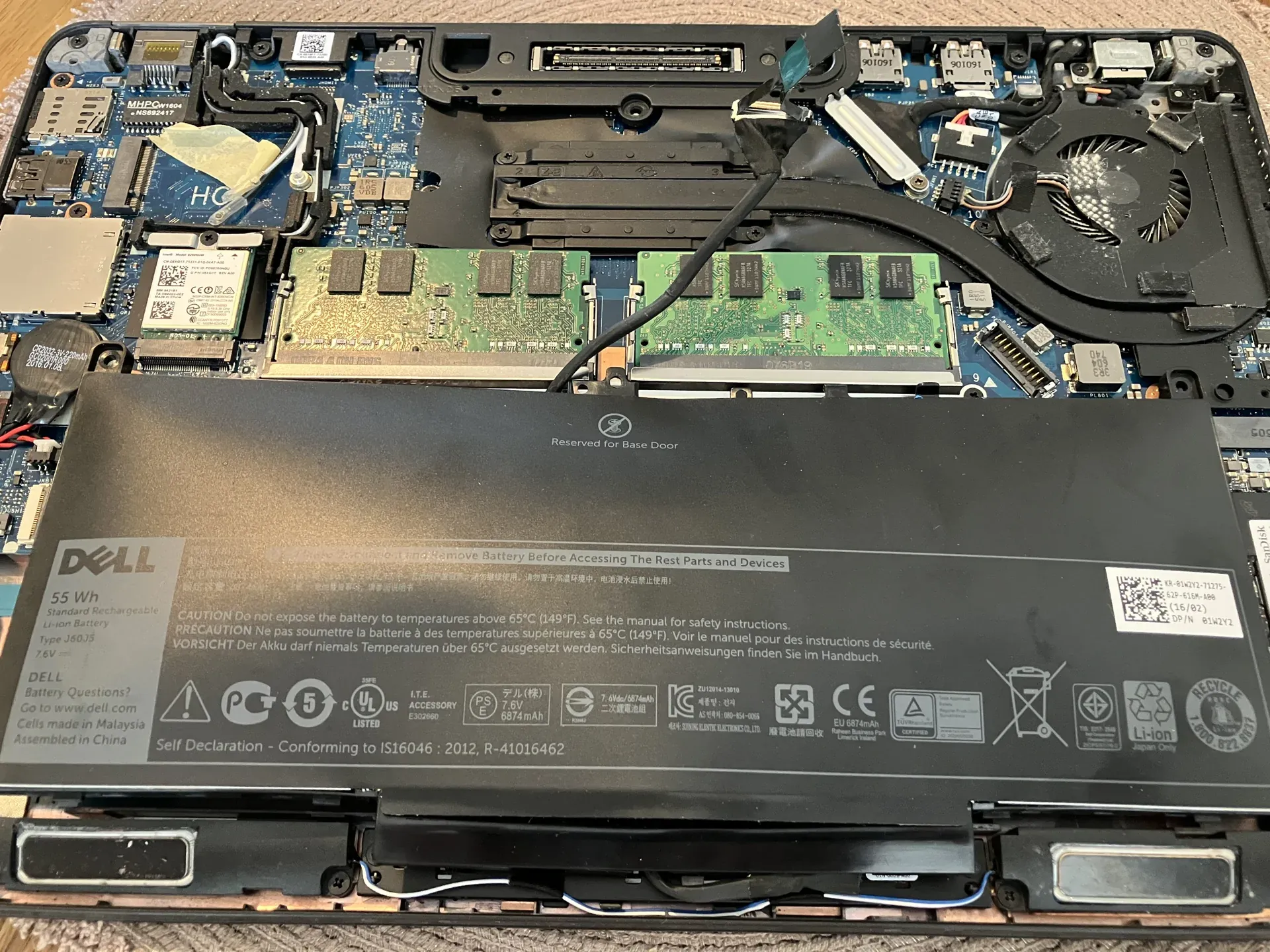 Computer repair technician diagnosing a laptop at PC Fix Express in Leatherhead, Surrey